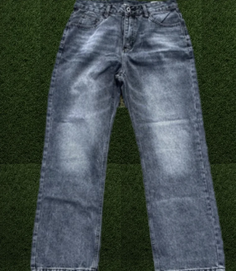 Grey wash jeans on turf